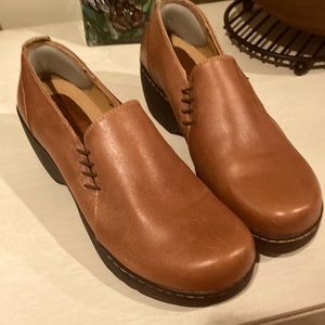 Brown leather clogs